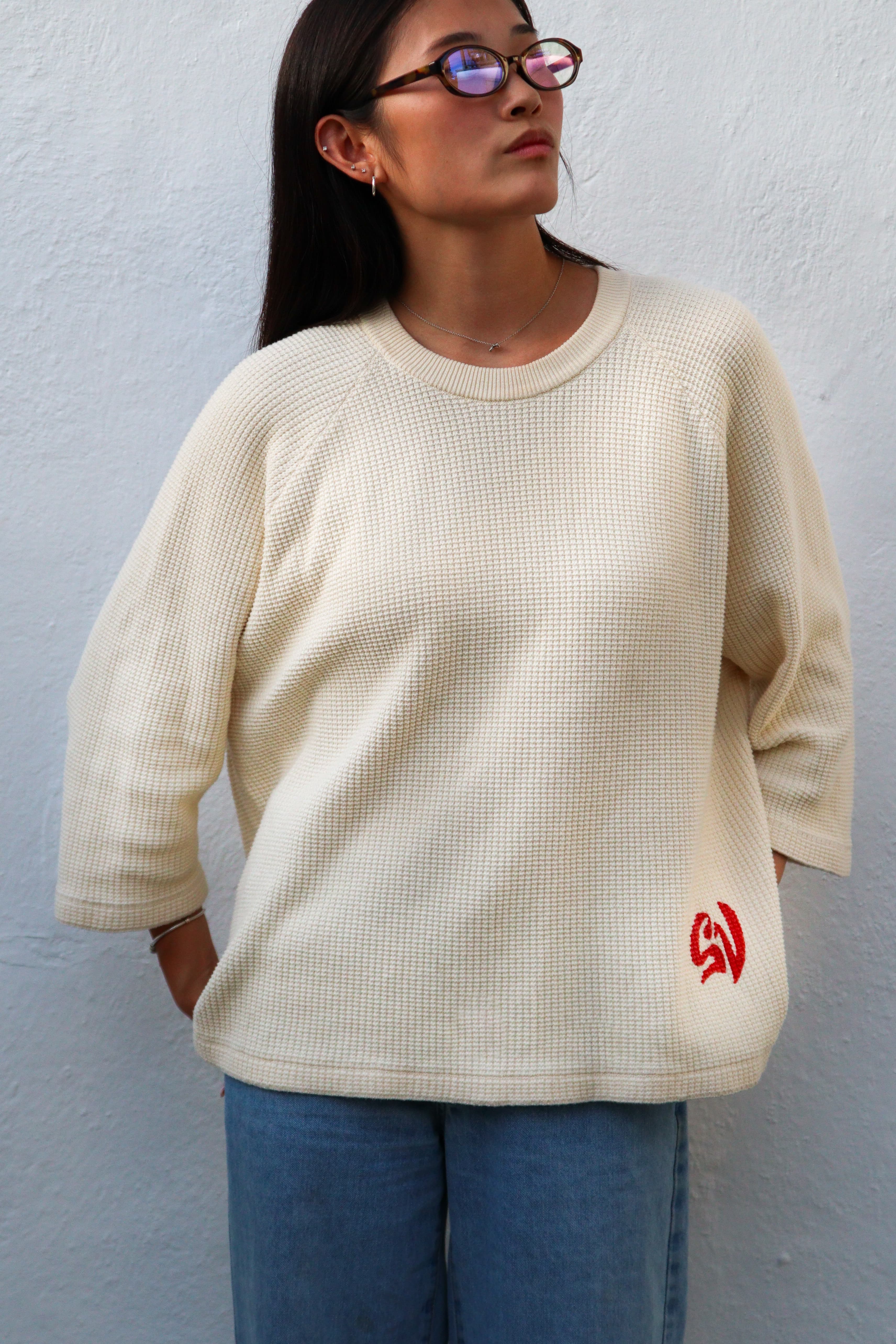 On-model, female, front, straight on, plain studio background, showing the 3/4 sleeve and relaxed fit.