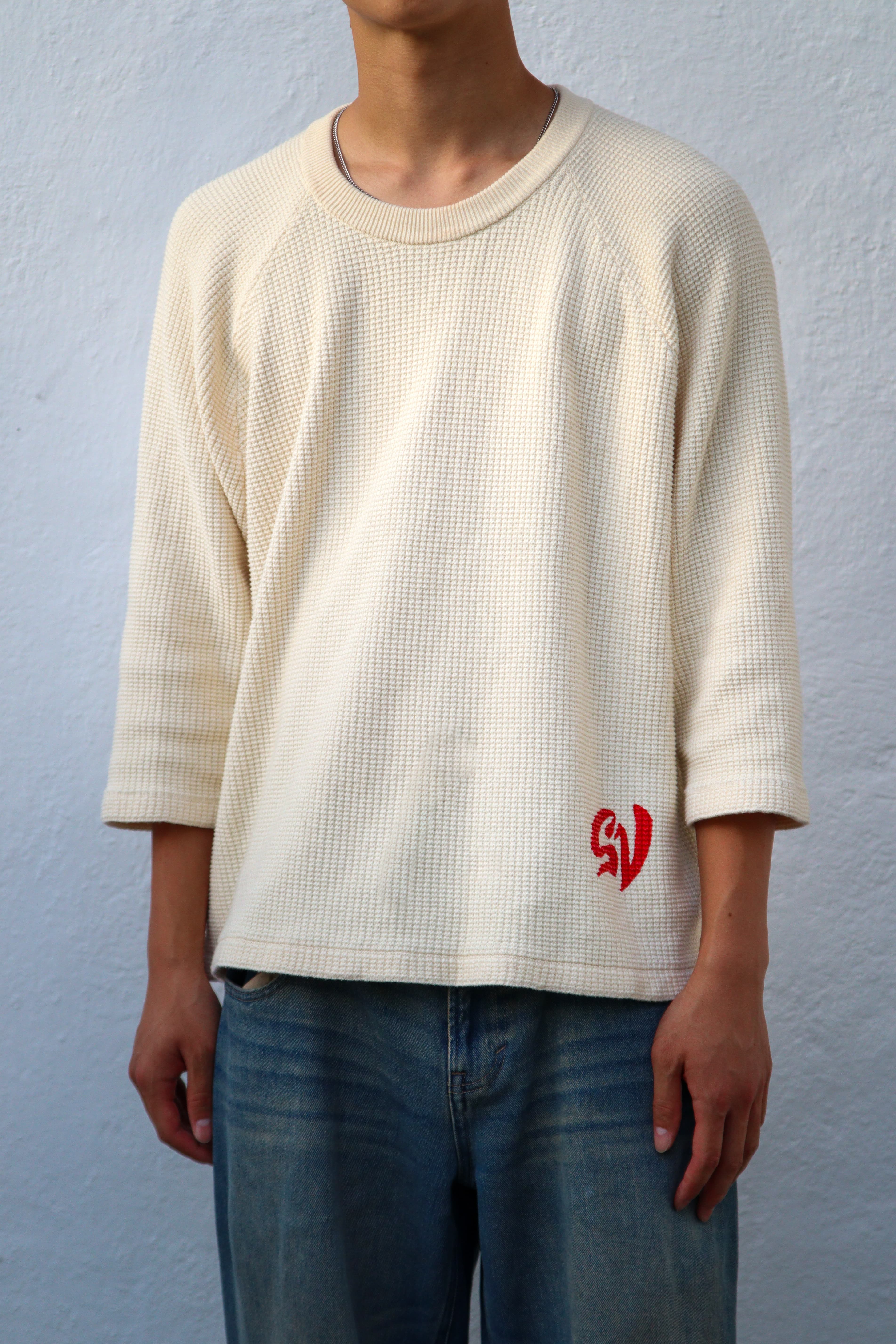 On-model, male, front, straight on, plain studio background, showing the 3/4 sleeve and relaxed fit.